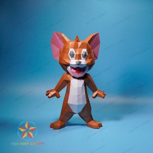 May include: A papercraft model of Tom from the cartoon Tom and Jerry. The model is made of brown, white, and pink paper and is standing on a blue background.