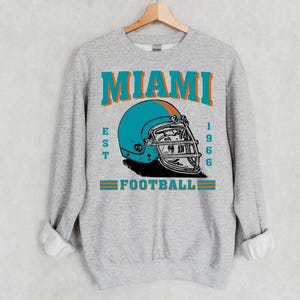 Sudadera retro azul de fútbol de Miami Est 1966, sudadera con capucha vintage de los años 90 con casco del equipo de fútbol de Miami, sudadera de fútbol americano, para ella, para él