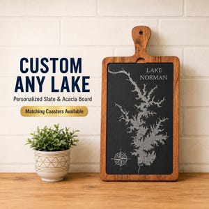 May include: A rectangular serving board with a dark slate center and a brown acacia wood frame and handle. The slate features an engraved map of Lake Norman and a compass rose. Text on the image reads: CUSTOM ANY LAKE, Personalized Slate & Acacia Board, Matching Coasters Available.