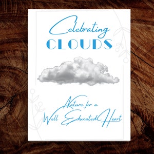May include: A white card with blue text that reads "Celebrating Clouds Nature for a Well Educated Heart". A gray cloud is pictured above the text.