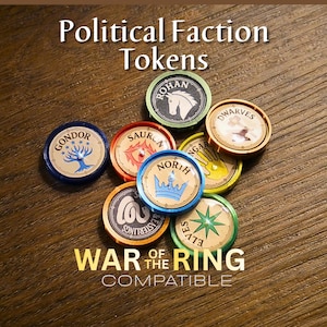 May include: A collection of round, colorful plastic political faction tokens for the War of the Ring game. Each token features a unique faction name and icon, including Gondor, Rohan, Sauron, Dwarves, North, and Elves, with text labels.