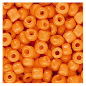 May include: A close-up shot of a collection of orange beads in different forms, including ring-shaped and square beads. The beads are a bright, solid orange, and the image is well-lit, showing the smooth texture. These beads are suitable for jewellery making and crafts.