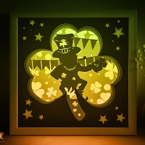 Plantilla SVG de caja de sombras del Día de San Patricio, caja de luz de papel cortado con cricut SVG para festividades irlandesas, caja de luz de papel cortado con payaso de la suerte en capas 3D