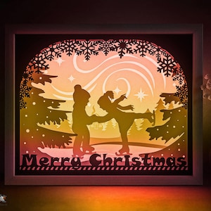 Joyeux Noël Shadow box modèle SVG, patinage de conte de fées d'hiver Papercut Lightbox cricut SVG 3D en couches Papier découpé DXF Papercraft