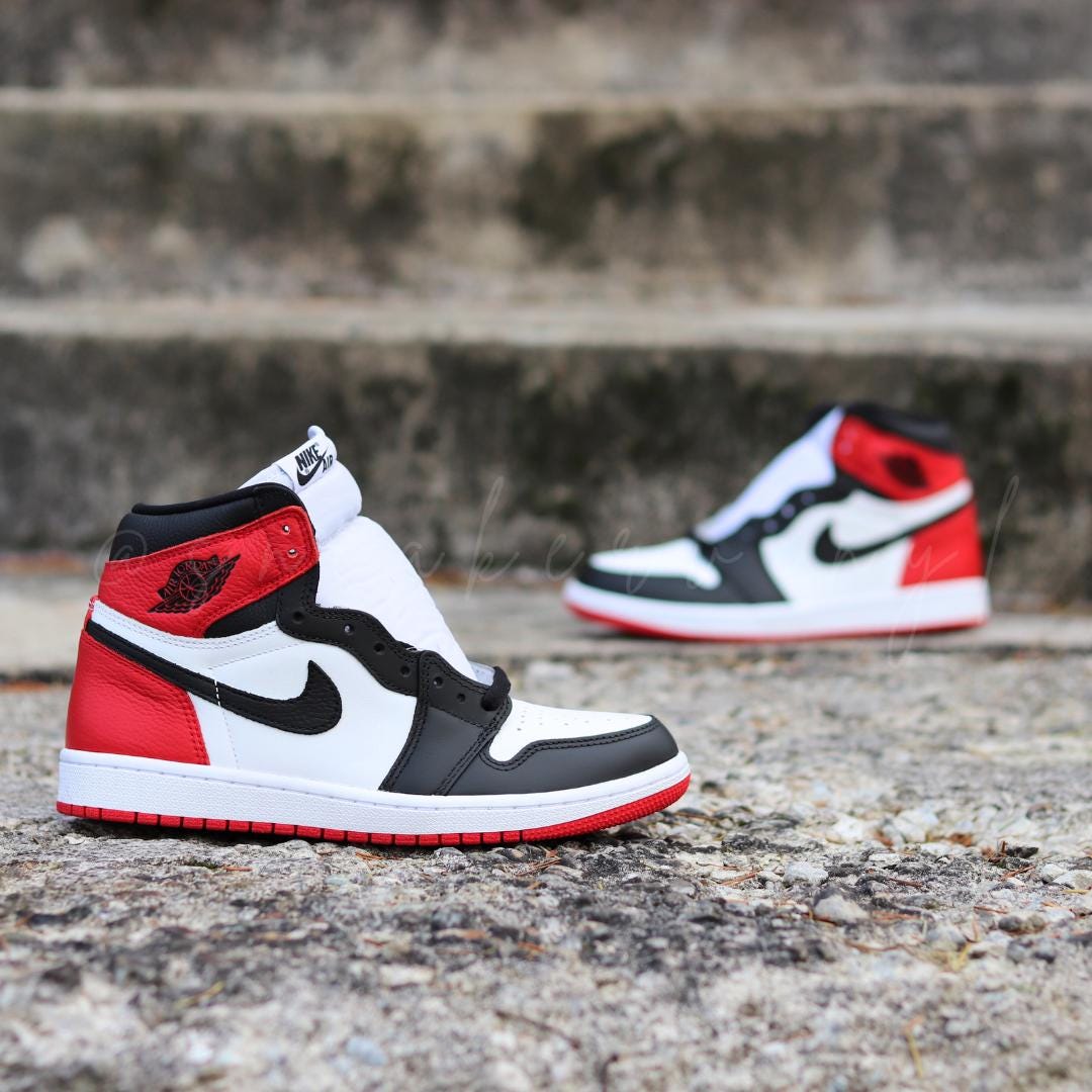 red black and white high top jordans