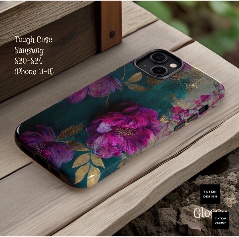 May include: A teal phone case with a floral design featuring pink and purple flowers with gold accents. The case is compatible with Samsung S20-S24 and iPhone 11-15.