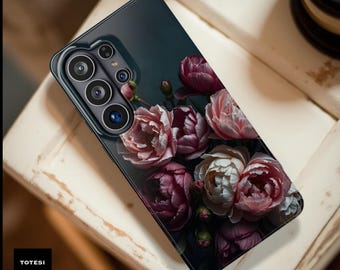 May include: A black phone case with a floral design featuring pink, white, and burgundy peonies. The case has a magnetic feature and the text "Magnetic" is visible at the top. The brand name "TOTESI DESIGN" is printed at the bottom.