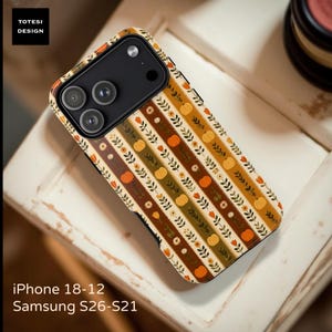 May include: A phone case featuring a repeating vertical pattern of orange pumpkins, small flowers, and green leafy vines on a background of alternating brown, tan, and olive stripes. The case has a black camera cutout with three lenses.