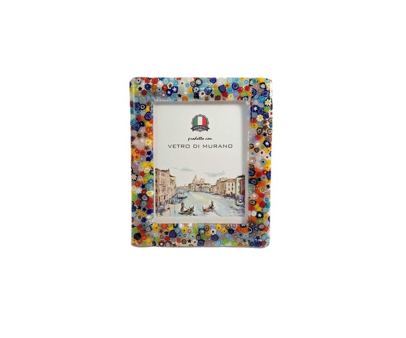 May include: A rectangular picture frame with a colorful mosaic design. The frame is decorated with small, multi-colored glass pieces. The frame holds a picture of a canal scene with gondolas. The text "Vetro di Murano" is visible.