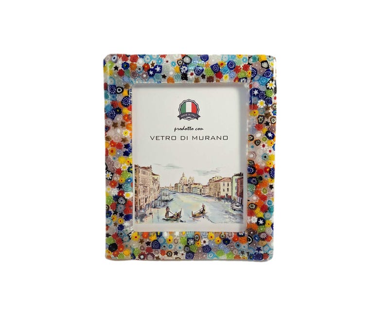 May include: A rectangular picture frame with a colorful mosaic border. The frame's edge is adorned with a vibrant pattern of small, multicolored glass pieces. The frame holds a picture of a canal scene, with the text "prodotte con VETRO DI MURANO".