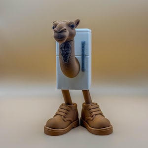 May include: A whimsical 3D-printed sculpture of a camel with a white refrigerator body, brown legs, and brown shoes. The camel's head is detailed with a dark tattoo on its neck. The sculpture is set against a neutral background.