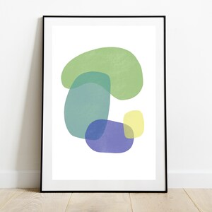 May include: Abstract art print featuring overlapping shapes in shades of green, blue, and yellow. The shapes are organic and fluid, creating a sense of movement and energy.