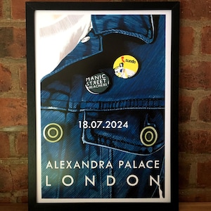 May include: A blue denim jacket with a yellow circle and the text "Alexandra Palace London" and "18.07.2024". The jacket has two buttons, one with the text "Manic Street Preachers" and the other with the text "Suede".