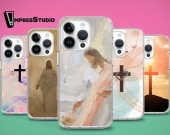May include: Five different iPhone cases with clear backgrounds and various religious-themed designs. The designs include a cross, a cross with a crown of thorns, a painting of Jesus, and a sunset with a cross.
