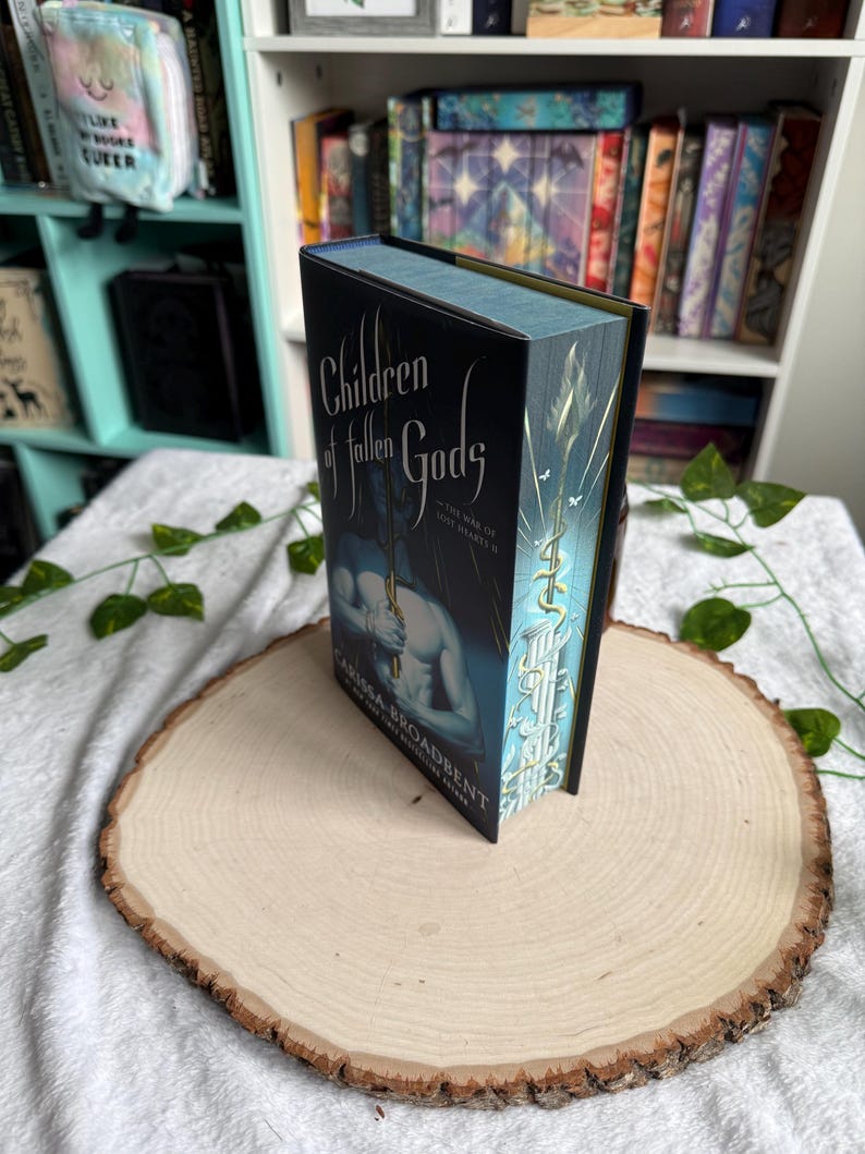 War of Lost Hearts Series by Carissa Broadbent with sprayed edges. Daughter of No Worlds, Children of Fallen Gods. Children of Fallen G
