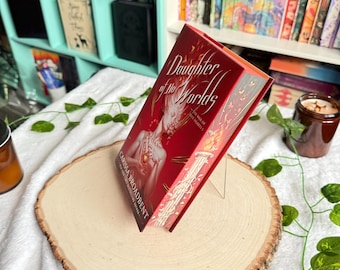 War of Lost Hearts Series by Carissa Broadbent with sprayed edges. Daughter of No Worlds, Children of Fallen Gods.