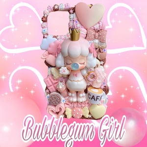May include: A decorative phone case with a pink and white color scheme. The case features a 3D design with a cartoon girl wearing a crown, surrounded by bows, hearts, and sweets. The text "Bubblegum Girl" is displayed at the bottom.