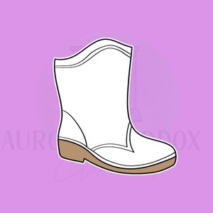 Puede incluir: Bota blanca de tobillo con suela marrón. La bota tiene una punta puntiaguda y un diseño sencillo.