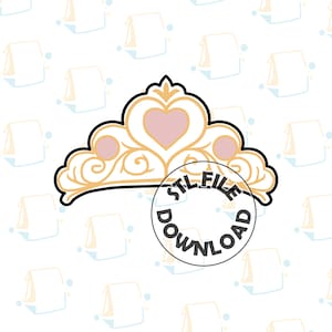 May include: A gold-colored tiara design with a pink heart-shaped center and circular accents. The tiara has a black outline and the words "STL FILE DOWNLOAD" are in a circle over the tiara.