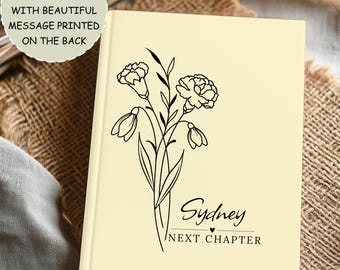May include: A cream-colored journal with a black floral design and the name "Sydney" with "NEXT CHAPTER" below it. The journal is a custom retirement gift with a message printed on the back.