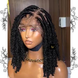 May include: A black lace front wig with short, curly, dreadlock-style hair. The wig is styled in a bob with a side part. The wig is on a mannequin head.