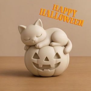 May include: A cream-colored Halloween decoration featuring a sleeping cat atop a carved pumpkin. The pumpkin has a smiling face. The words "HAPPY HALLOWEEN" are in orange letters above the cat and pumpkin.