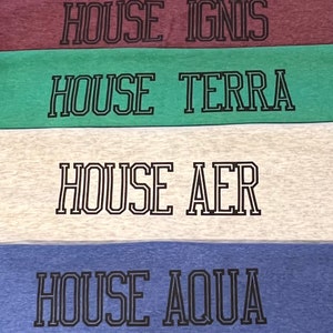 May include: Four fabric swatches in burgundy, green, off-white, and blue. Each swatch features the text "HOUSE IGNIS", "HOUSE TERRA", "HOUSE AER", and "HOUSE AQUA" in a black, outlined font.