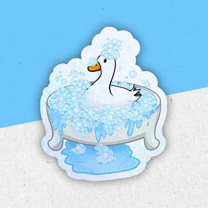 May include: A white duck taking a bath in a blue bathtub with white bubbles. The duck is sitting in the tub with its head tilted back and its eyes closed. The tub is filled with water and bubbles.