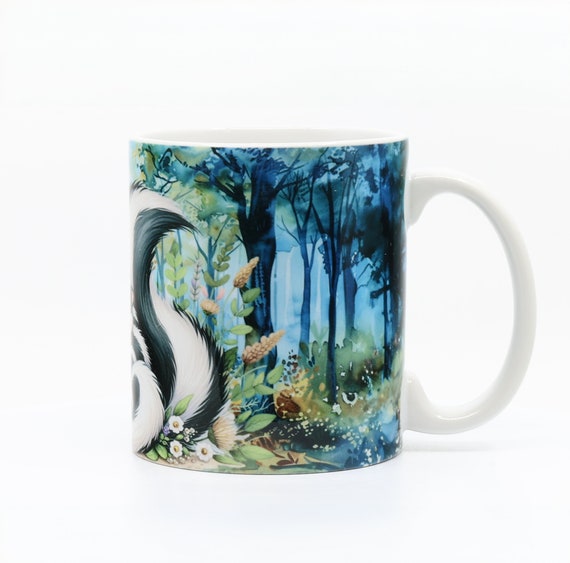 11oz mug with Mother skunk, baby skunks in wooded area and flowers.
