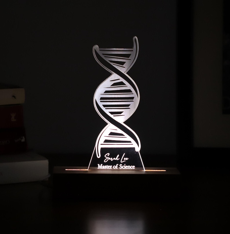 3D illusion lamp featuring a detailed DNA double helix design, illuminated in a white tone, personalized with a name, perfect as a unique and thoughtful gift for geneticists, scientists, or medical professionals specializing in human genome research
