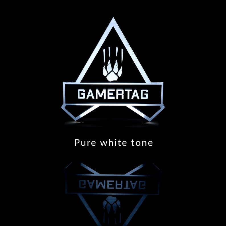 May include: A white illuminated sign with a triangular shape and a paw print inside. The sign says "GAMERTAG" in white letters.