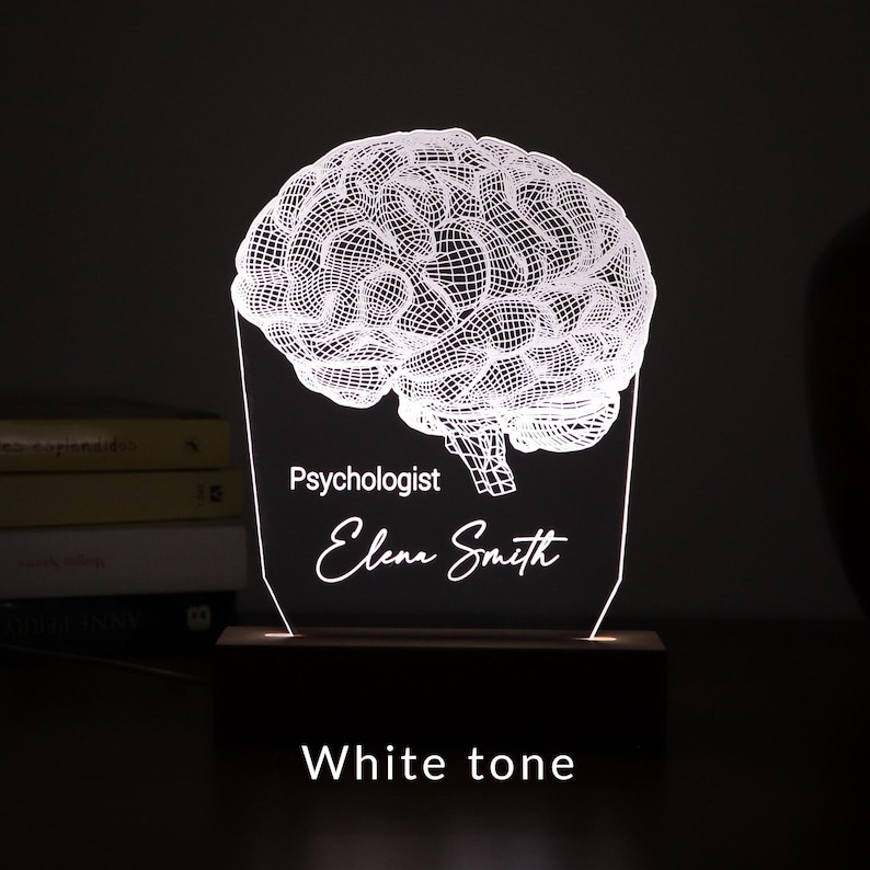 Personalized 3D illusion lamp featuring a detailed brain anatomy design, illuminated in a white tone,  perfect as a unique gift for mental health professionals.