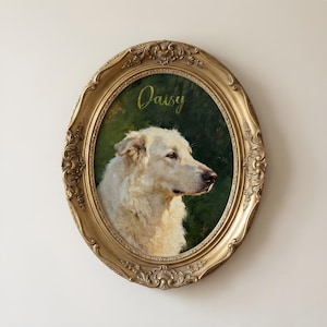 May include: Oval, gold-framed portrait of a white dog named Daisy. The dog is painted against a dark green background. The frame has ornate detailing.