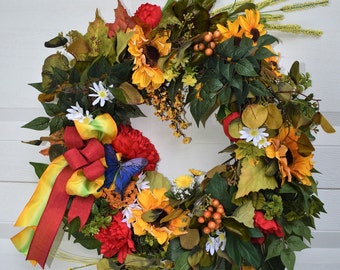 Sunflower Wreath; Warm Tuscan Colors for Front Door; Water Color Bow, Red Peonies; Golds, Emerald Greens, and Splash of Blue Wings on Wreath