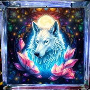 May include: A white wolf with blue eyes surrounded by pink lotus flowers against a dark background with a stained glass pattern and a full moon.