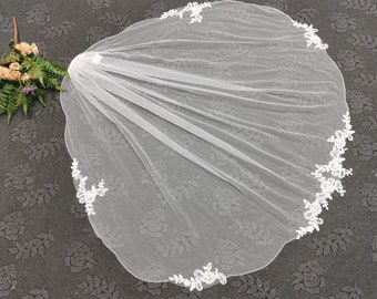 Wedding veil with laces and beads