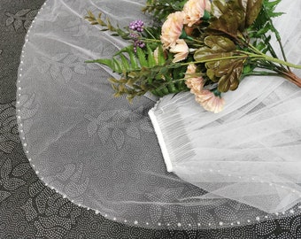 Wedding veil with pearls stitched by hand