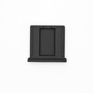 May include: Black plastic camera lens adapter with a rectangular opening.