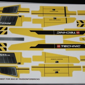 May include: A sheet of yellow and black custom stickers for the LEGO Technic 8043 model. The stickers feature the LEGO Technic logo, the model number, and various other details.