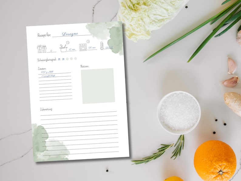 May include: A printable recipe template with a watercolor background in shades of green. The template is titled "Lasagna" and includes sections for ingredients, notes, and instructions.