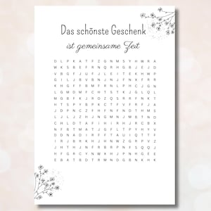 May include: A black and white word search puzzle with the text "Das schönste Geschenk ist gemeinsame Zeit" at the top. The puzzle contains the words "gemeinsame Zeit" hidden within a grid of letters.