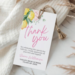 May include: A white gift tag with a watercolor lemon and floral design. The tag reads "Thank You" in pink script, with additional text below. A natural twine string is attached to the tag.