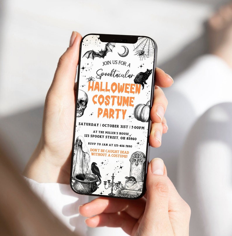 May include: A smartphone displays a Halloween party invitation. The invitation features a bat, spiderweb, black cat, skull, pumpkin, and other spooky illustrations. Text reads "Spooktacular Halloween Costume Party" with event details.