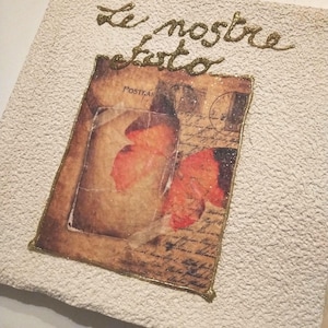 Album fotografico mis 30x30cm 30 pagine, 60 facciate circa 200 foto. Realizzato con carta e decorazione farfalle.