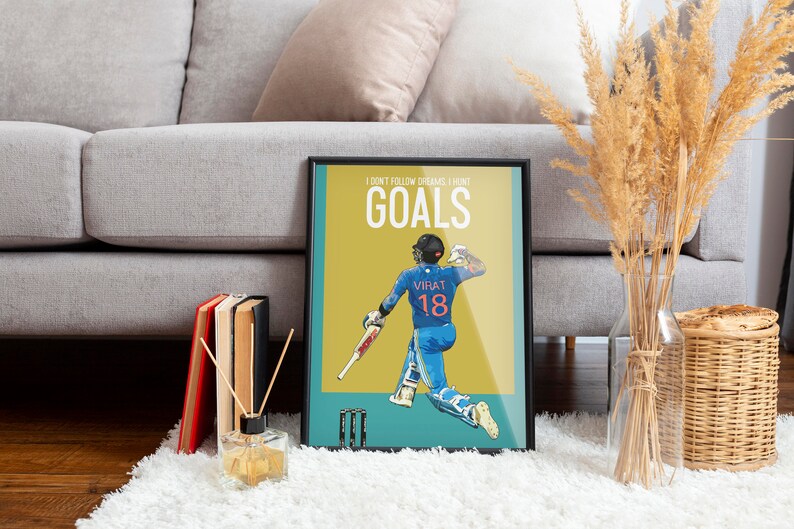 May include: A motivational poster featuring a cricket player in a blue uniform with the number 18 on the back. The poster has a yellow background with the text "I don't follow dreams I hunt goals" and the player's name "Virat" printed on the uniform.