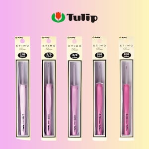 May include: Five crochet hooks in varying shades of pink, each in a clear plastic package. The brand name "Tulip" is at the top, with "ETIMO Rose" and hook sizes 2/0 to 6/0 visible on the packaging.