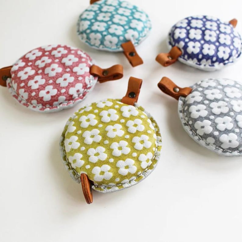 a group of four fabric covered objects sitting on top of a table