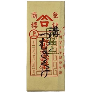 May include: A cream-coloured rectangular paper label with Japanese text and red accents. The label features vertical text columns, with a prominent red emblem at the top. The text is in a traditional Japanese script.