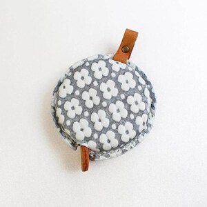 a round purse with a flower pattern on it