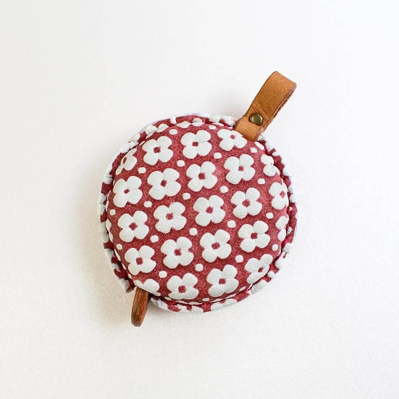 a red and white flowered coin purse